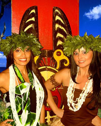 2 female costumed polynesian hula dancers